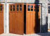 Traditional swing out garage doors made from mahogany and cedar wood
