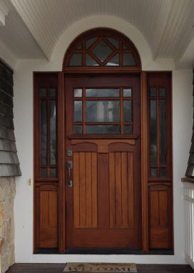 Unique front entry door with half round transom and sidelites